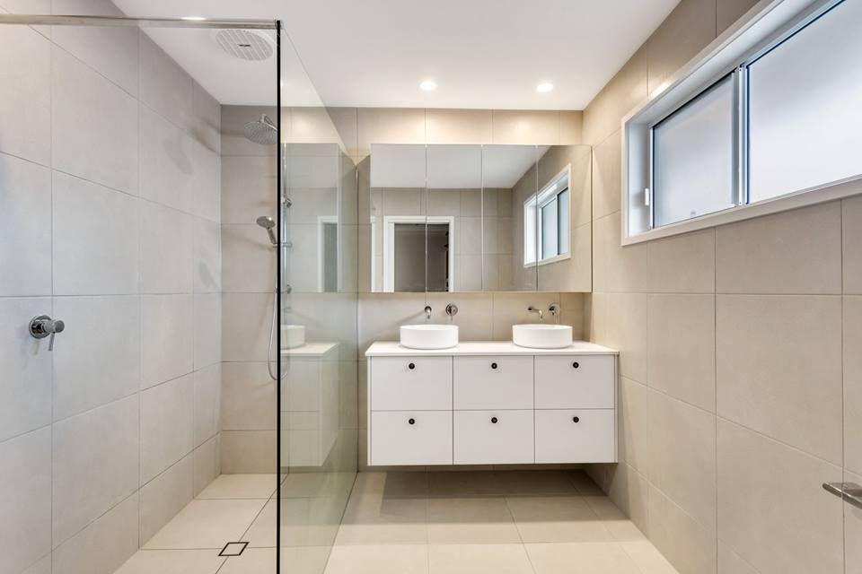 Modern Bathroom With White Vanity Cabinets And Glass Shower Room — Interior Design in Tweed Heads, NSW