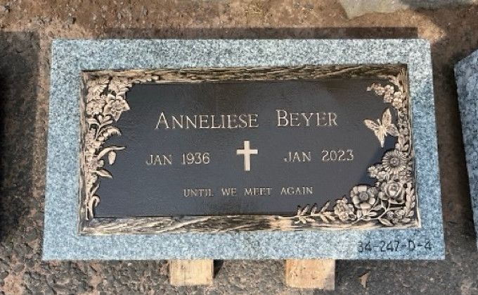 Misty bronze plaques with floral borders and butterflies