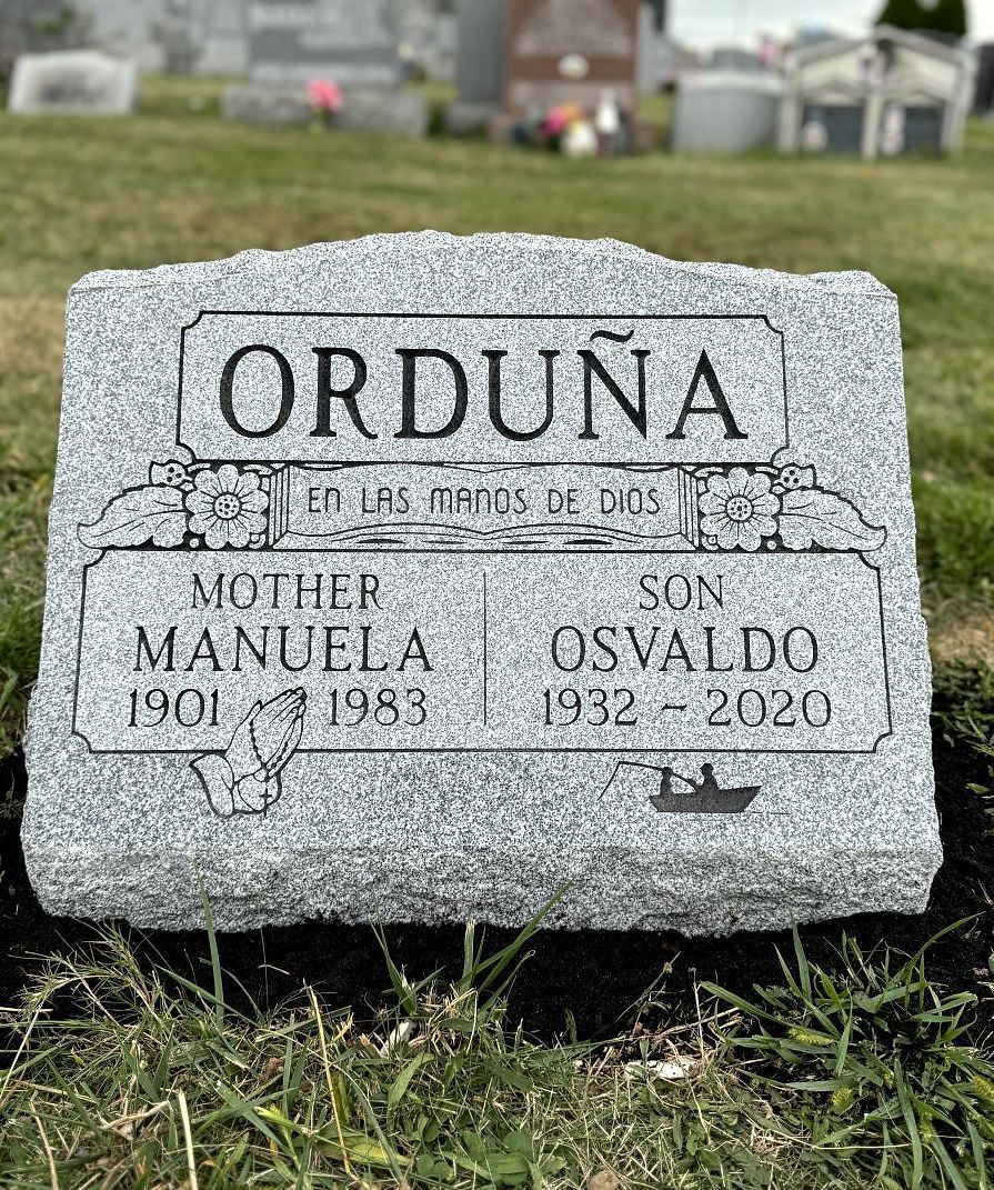 A double-slant gravestone for a married couple buried at St. James Cemetery, Woodbridge, NJ.