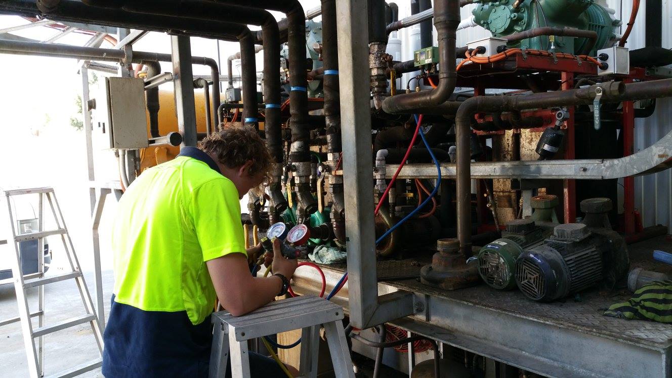 Technician is Checking Air Conditioner— Newcastle Air & Refrigeration In New Lambton, NSW