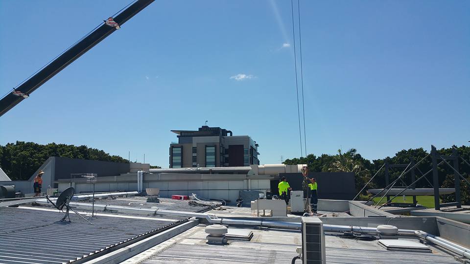 Installing Inverter Air Conditioner on a  Roof— Newcastle Air & Refrigeration In New Lambton, NSW