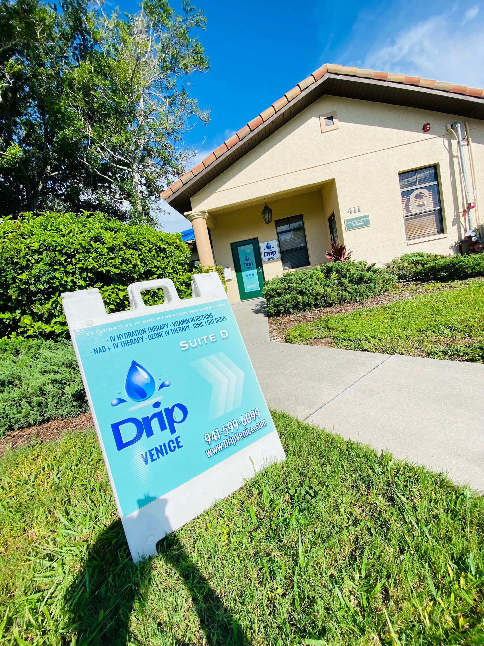 A pink and black signage logo with a black circle in the middle