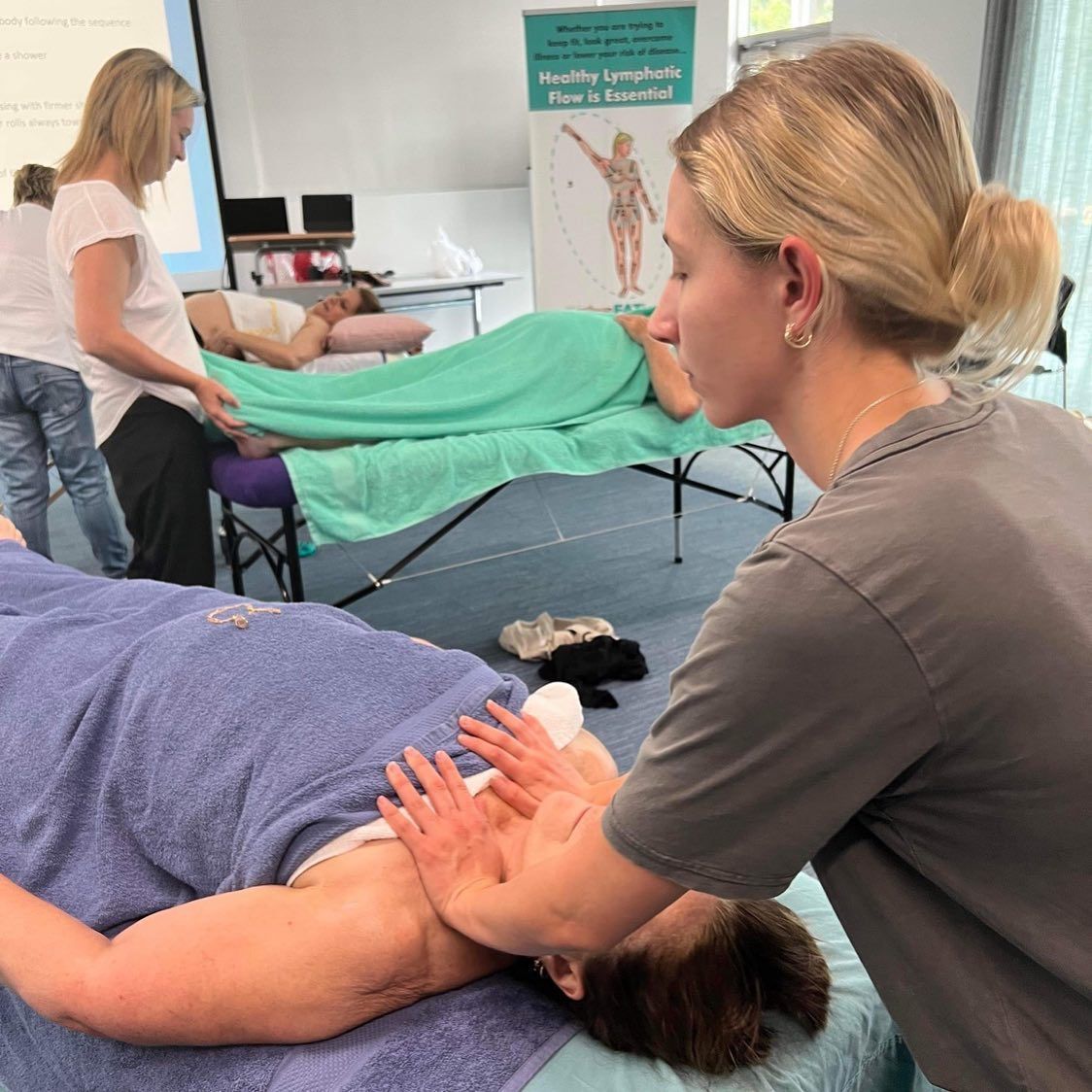 A Woman is Giving a Massage to Another Woman — Your Body Revolution in Caloundra, QLD