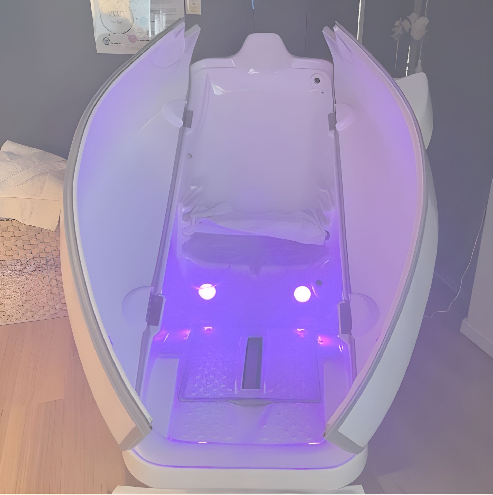 A Purple Light is Shining on a White Object in a Room — Your Body Revolution in Caloundra, QLD