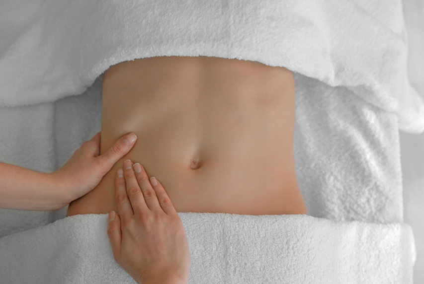 A Woman is Getting a Massage on Her Stomach in a Spa — Your Body Revolution in Caloundra, QLD