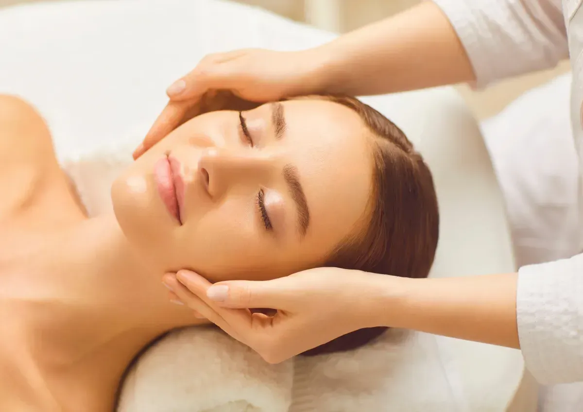 A Woman is Getting a Facial Massage at a Spa — Your Body Revolution in Caloundra, QLD