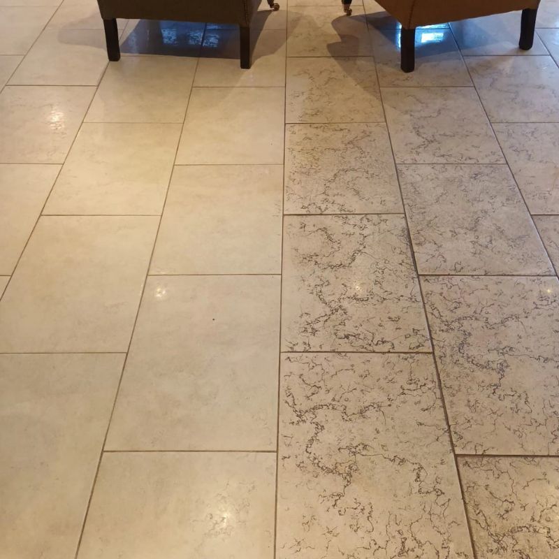 A before and after photo of a tiled floor with a hose attached to it.
