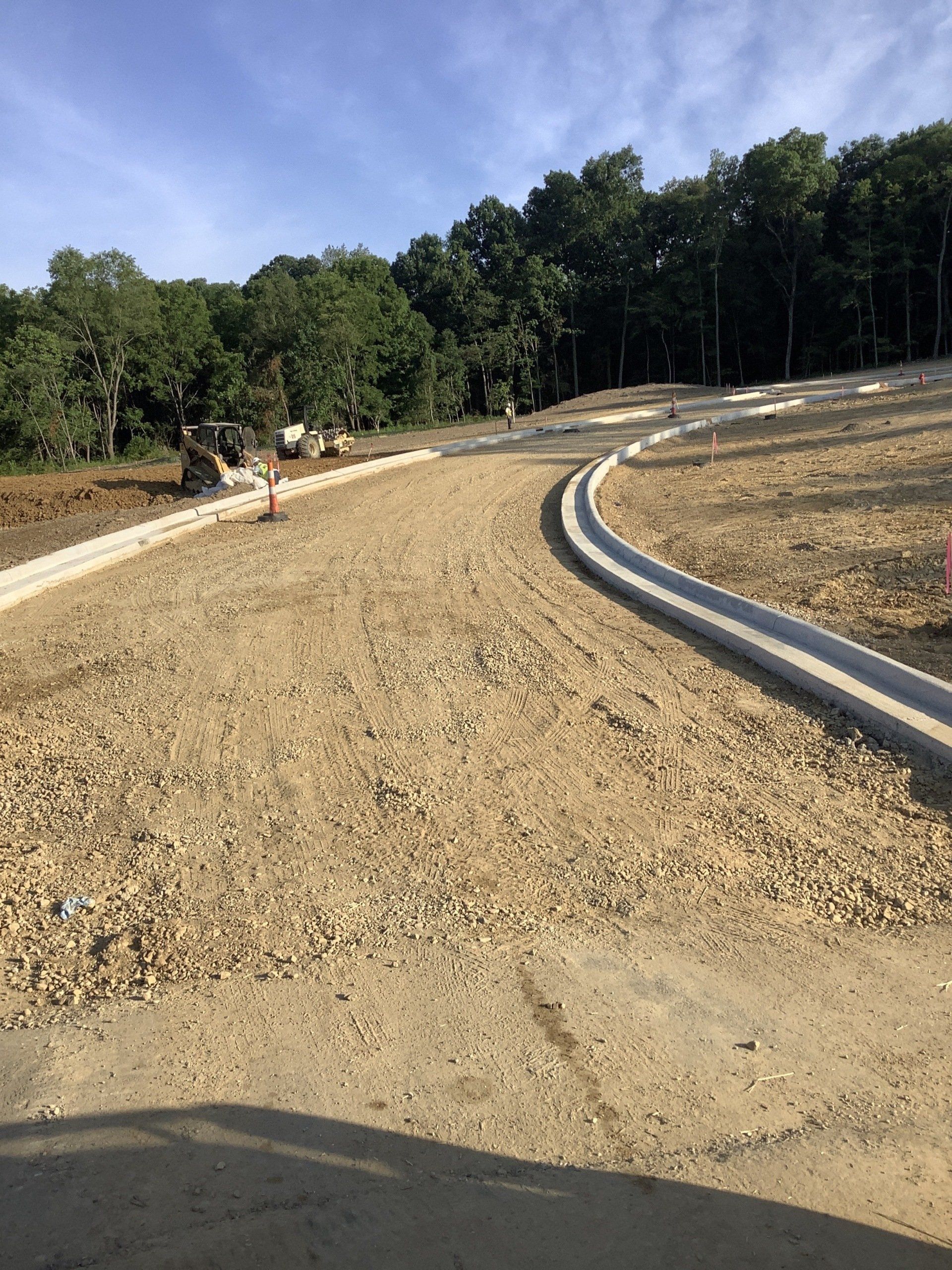 The foundation of the road and side walks are set in this picture.