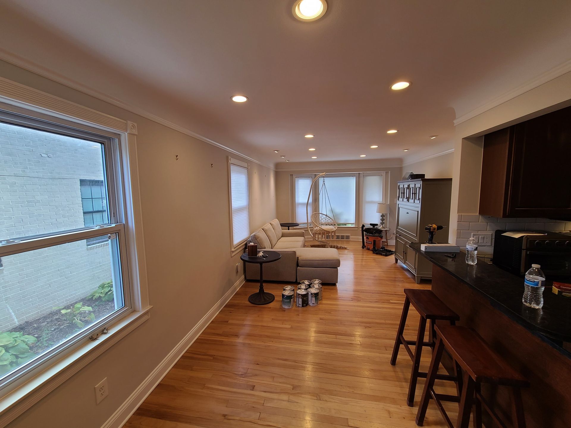 A living room with hardwood floors and a couch