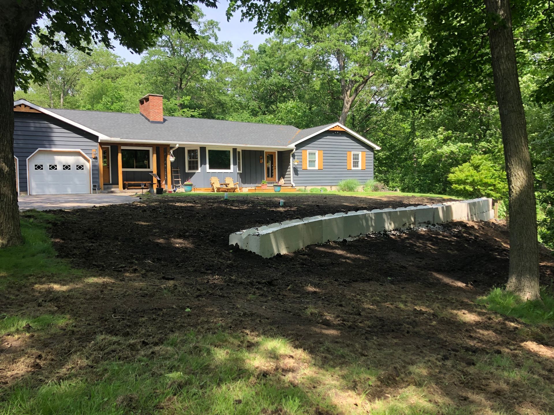 A house with a lot of dirt in front of it