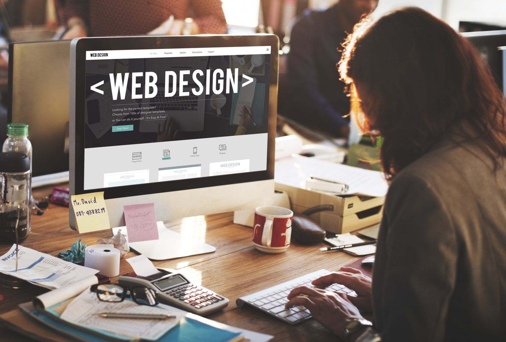 a web designer working on a computer in arizona