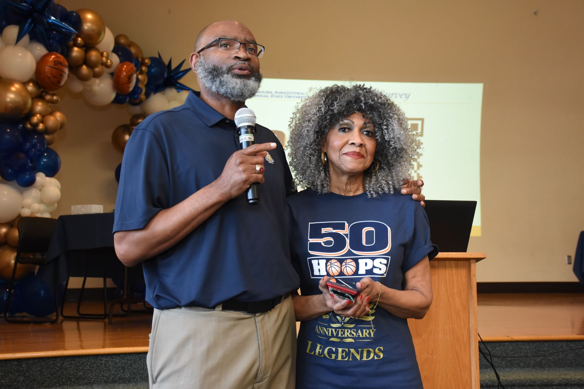 Man with microphone and woman in a 