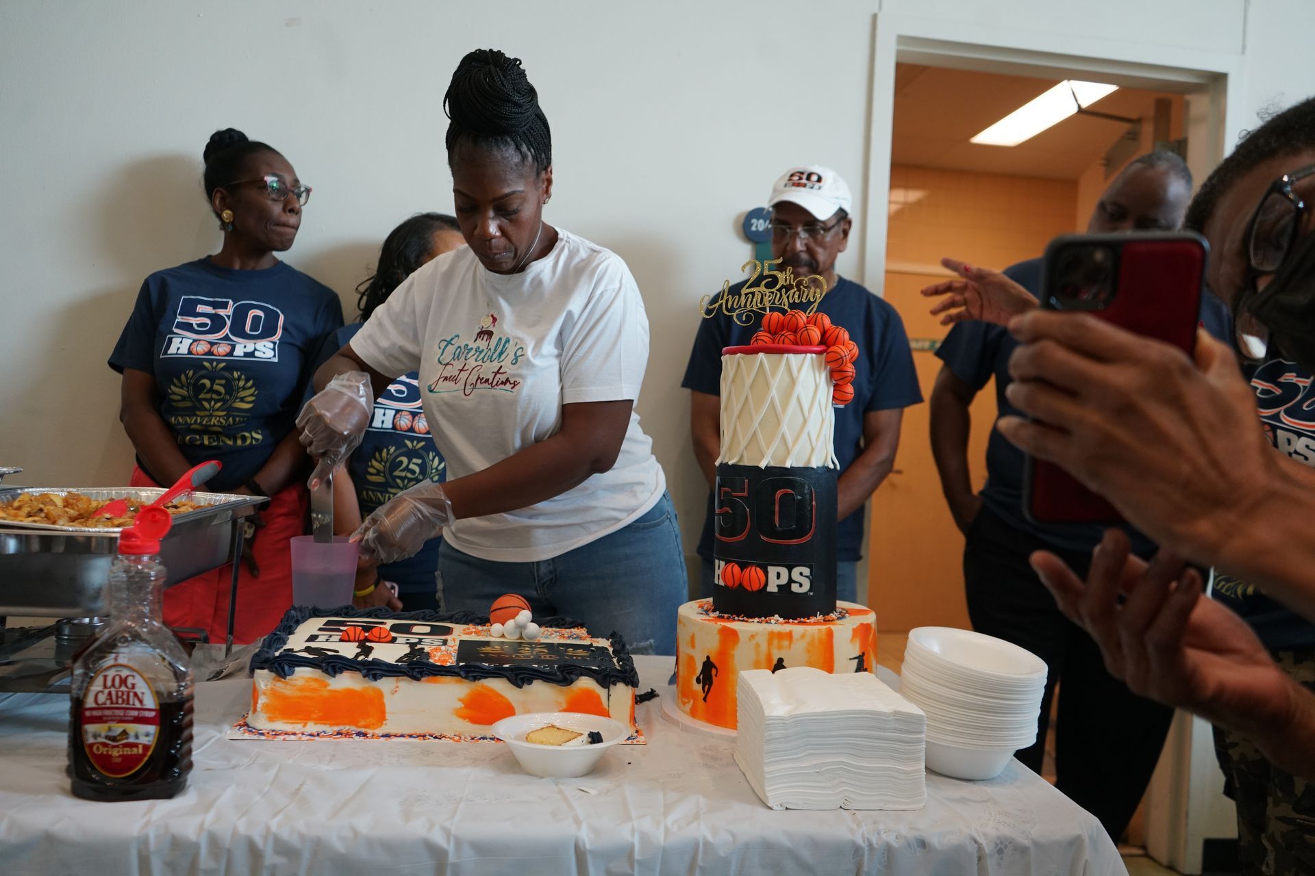 Woman cutting a cake with 