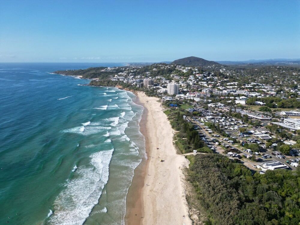An Aerial View of a Beach With a City — Noosa Tree Stump Removal in Coolum, QLD
