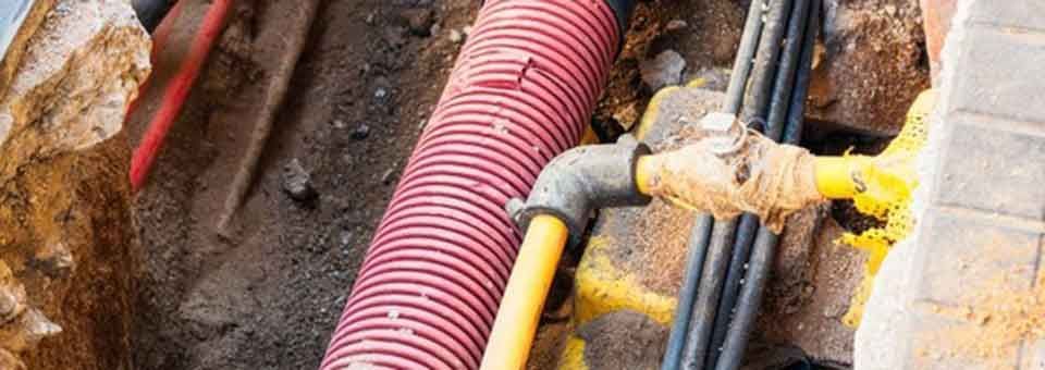 Image of exposed underground assets in street