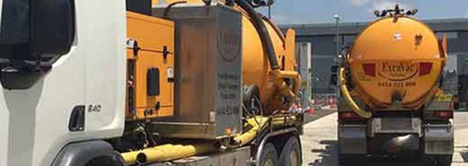 Two Excavac vacuum trucks