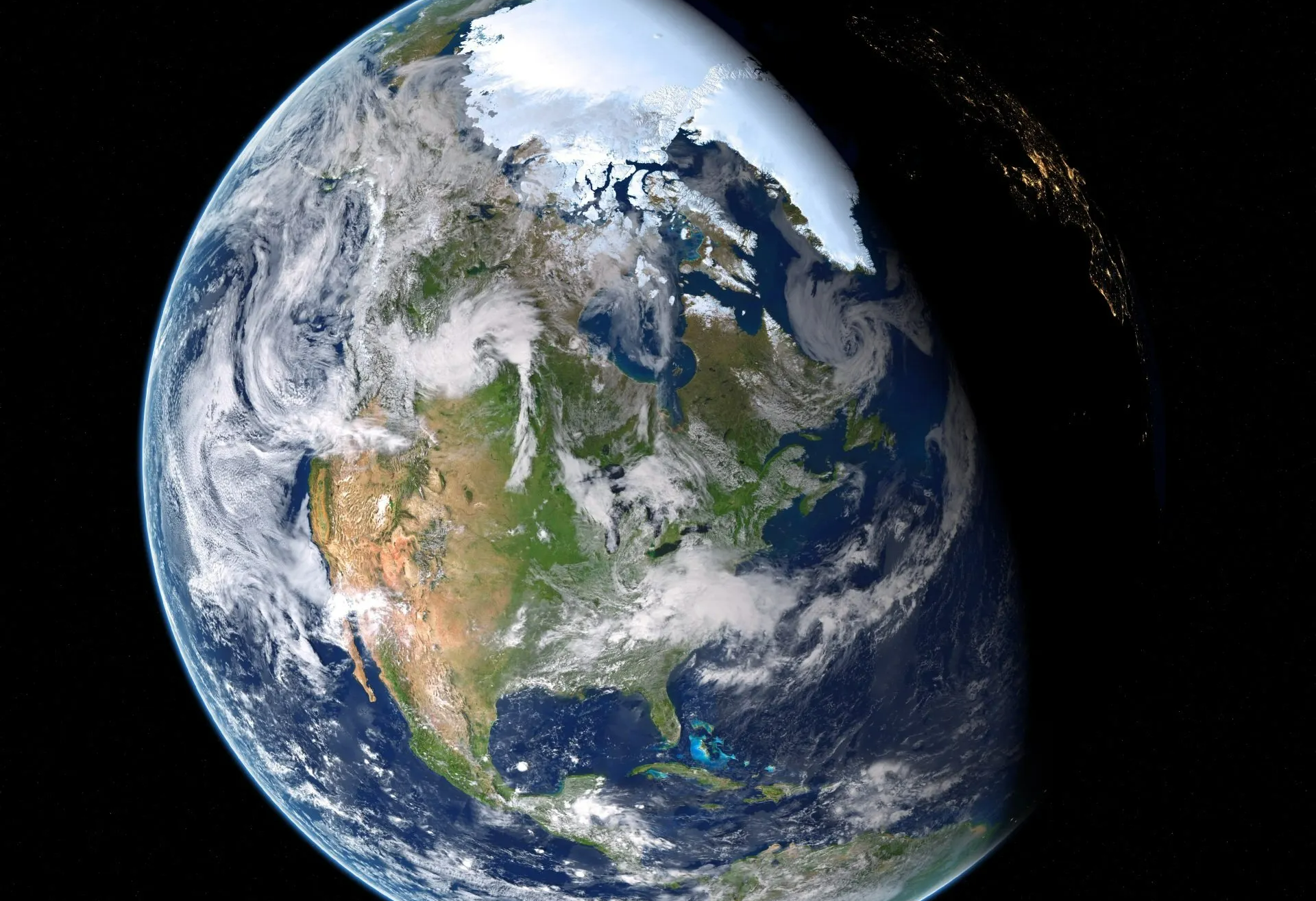 Earth, North America centered, with visible clouds and ice. Partially lit by the sun, showing night on the right.