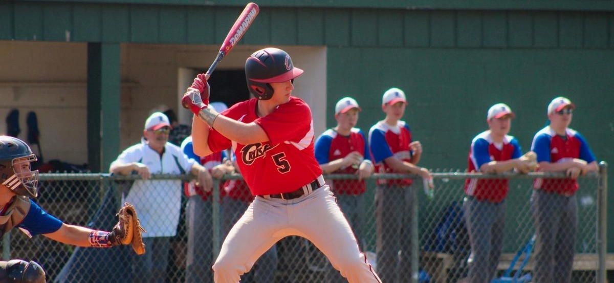 A baseball player in a red jersey with the number 5 on it is getting ready to bat. A baseball player in a red jersey with the number 5 on it is getting ready to bat.