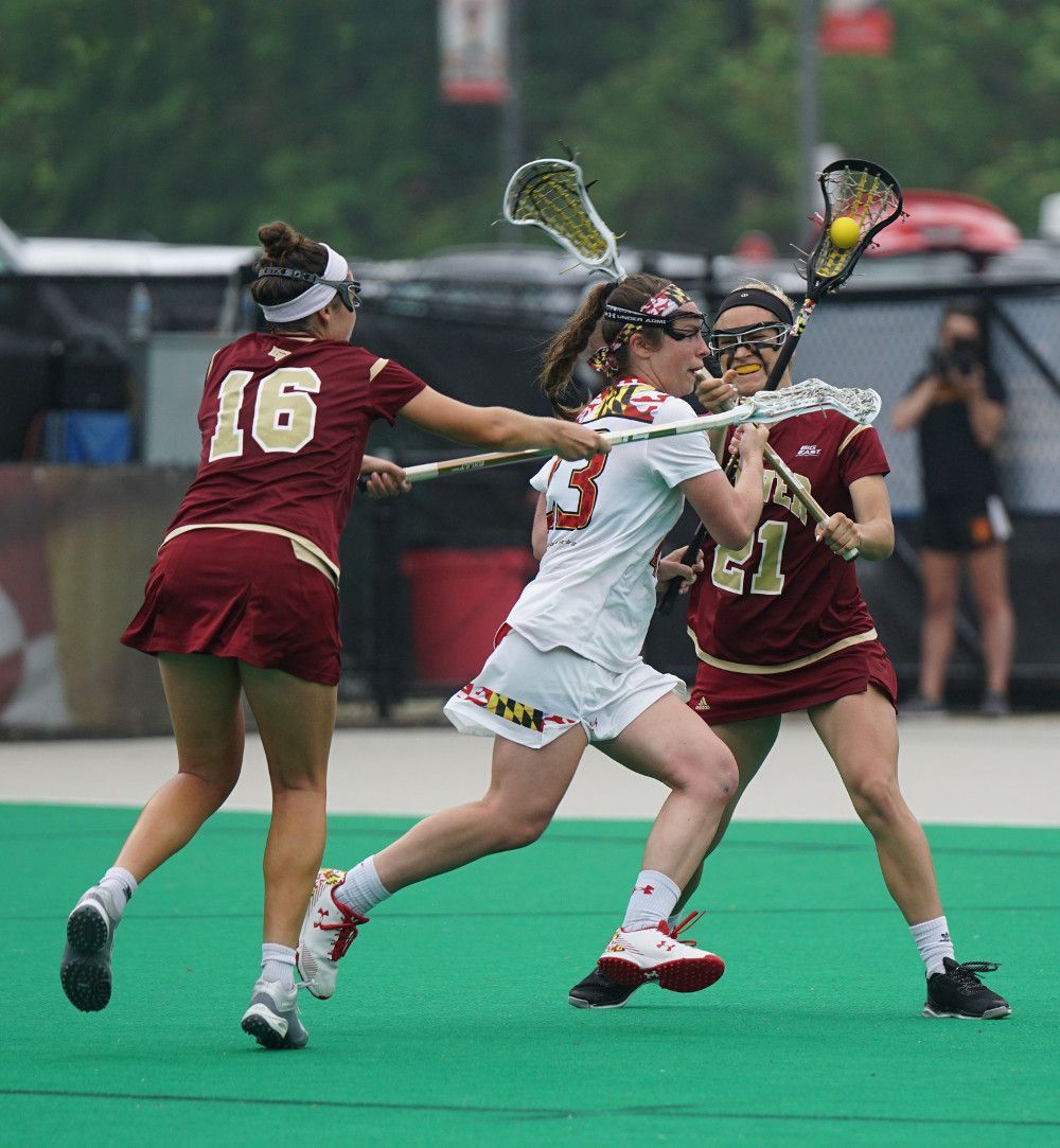 A lacrosse player with the number 16 on her shirt A lacrosse player with the number 16 on her shirt
