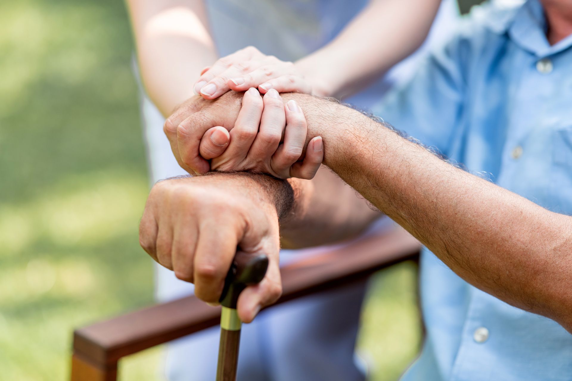 lady care holding elder hands