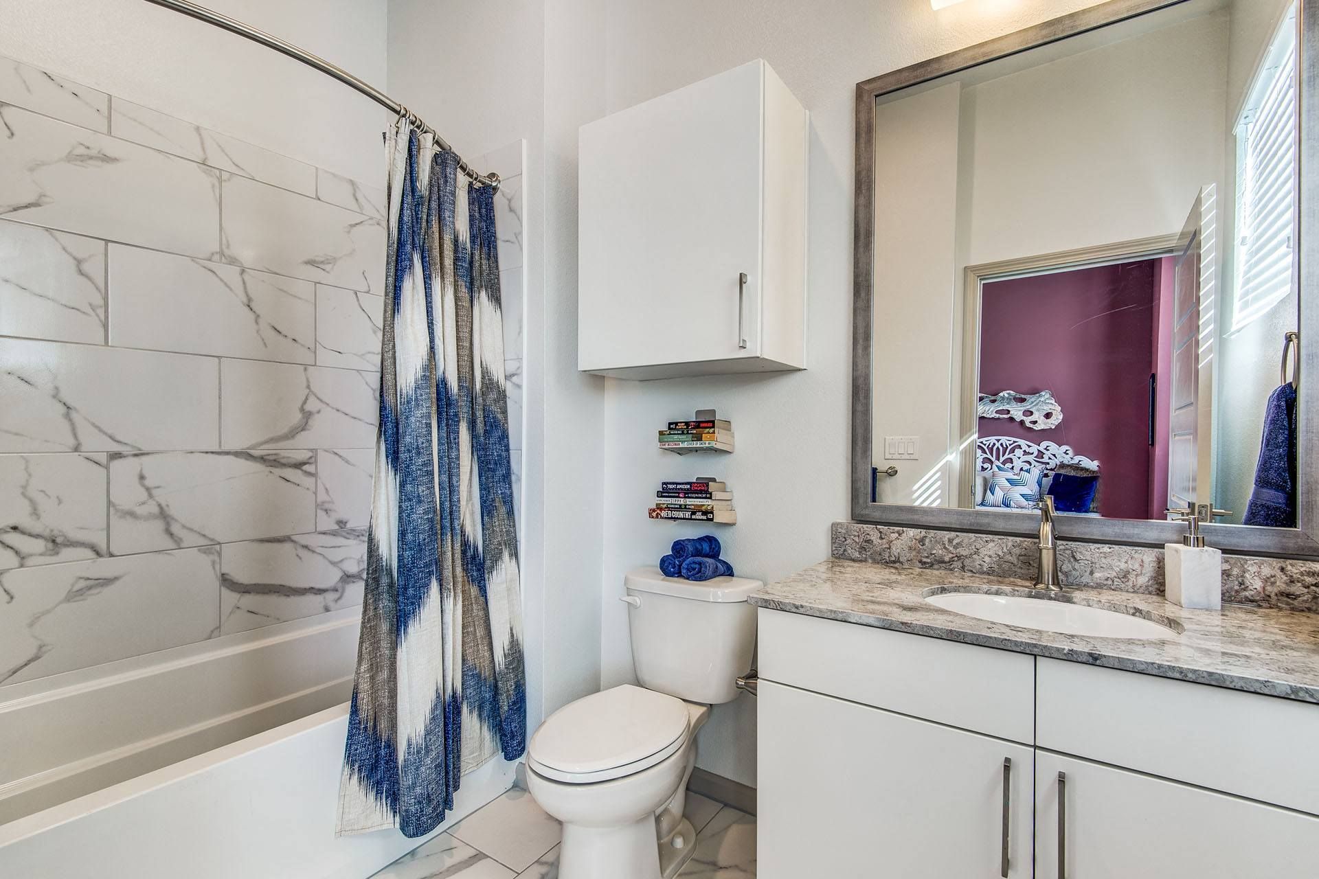 Apartments for Rent Lewisville - Hebron 121 Station - Bathroom With Tile Flooring, Cabinets, and a Modern Shower