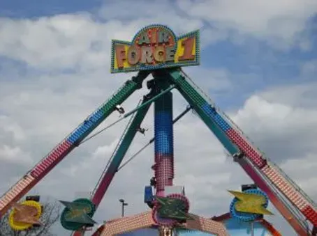 A carnival ride called air force 1 with a blue sky in the background