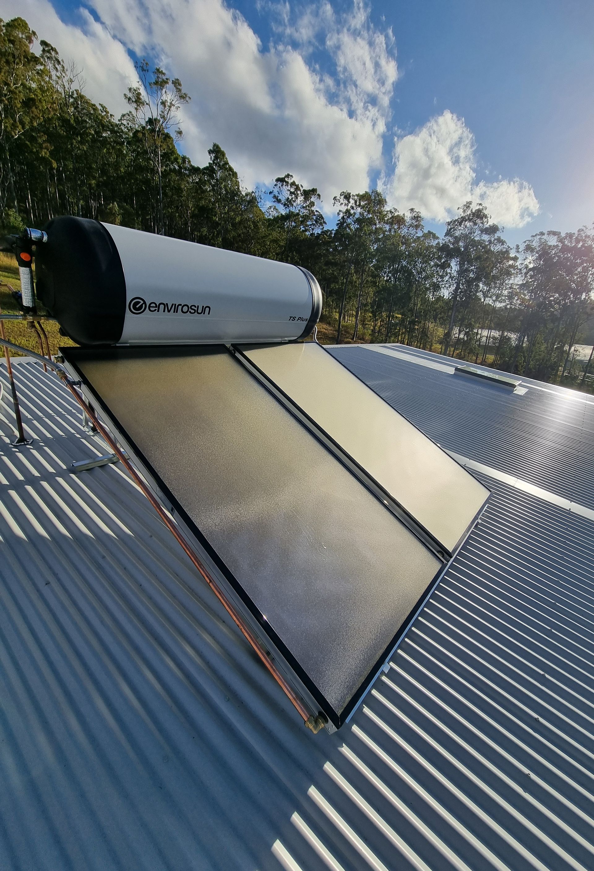 Solar Water Heater on A Corrugated Metal Roof — Hills 2 Ocean Plumbing in Maclean, NSW