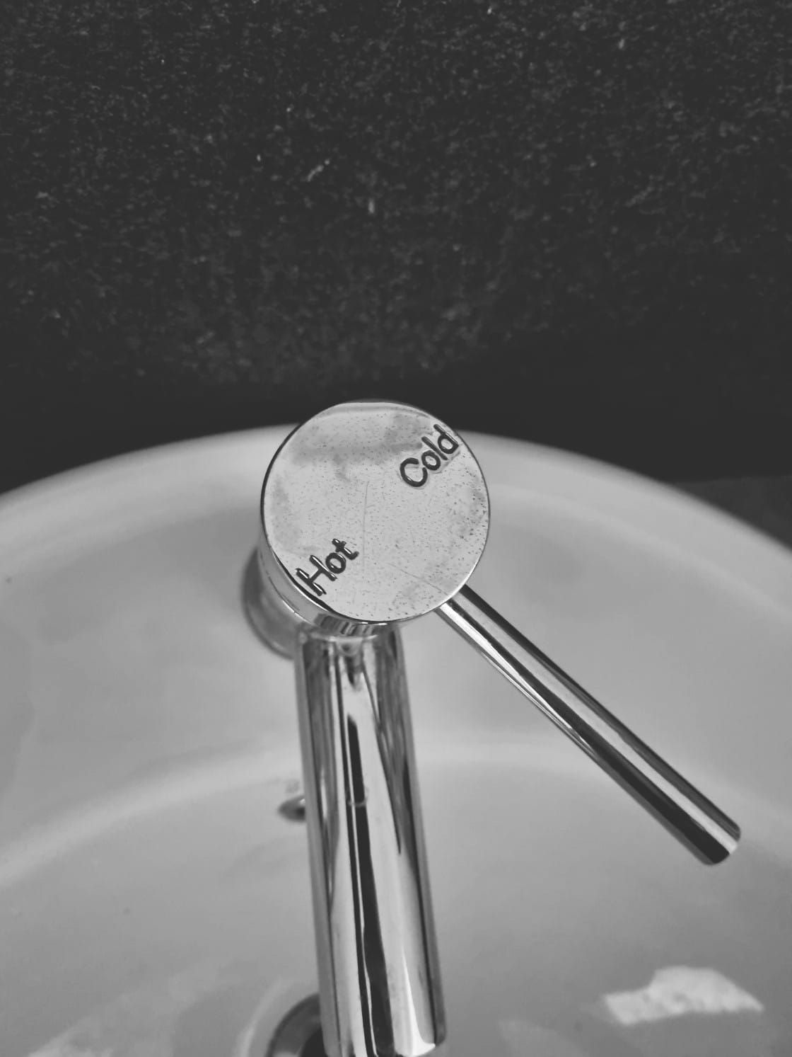 Silver Faucet in a White Sink, With a Circular Hot/cold Dial — Hills 2 Ocean Plumbing in Maclean, NSW