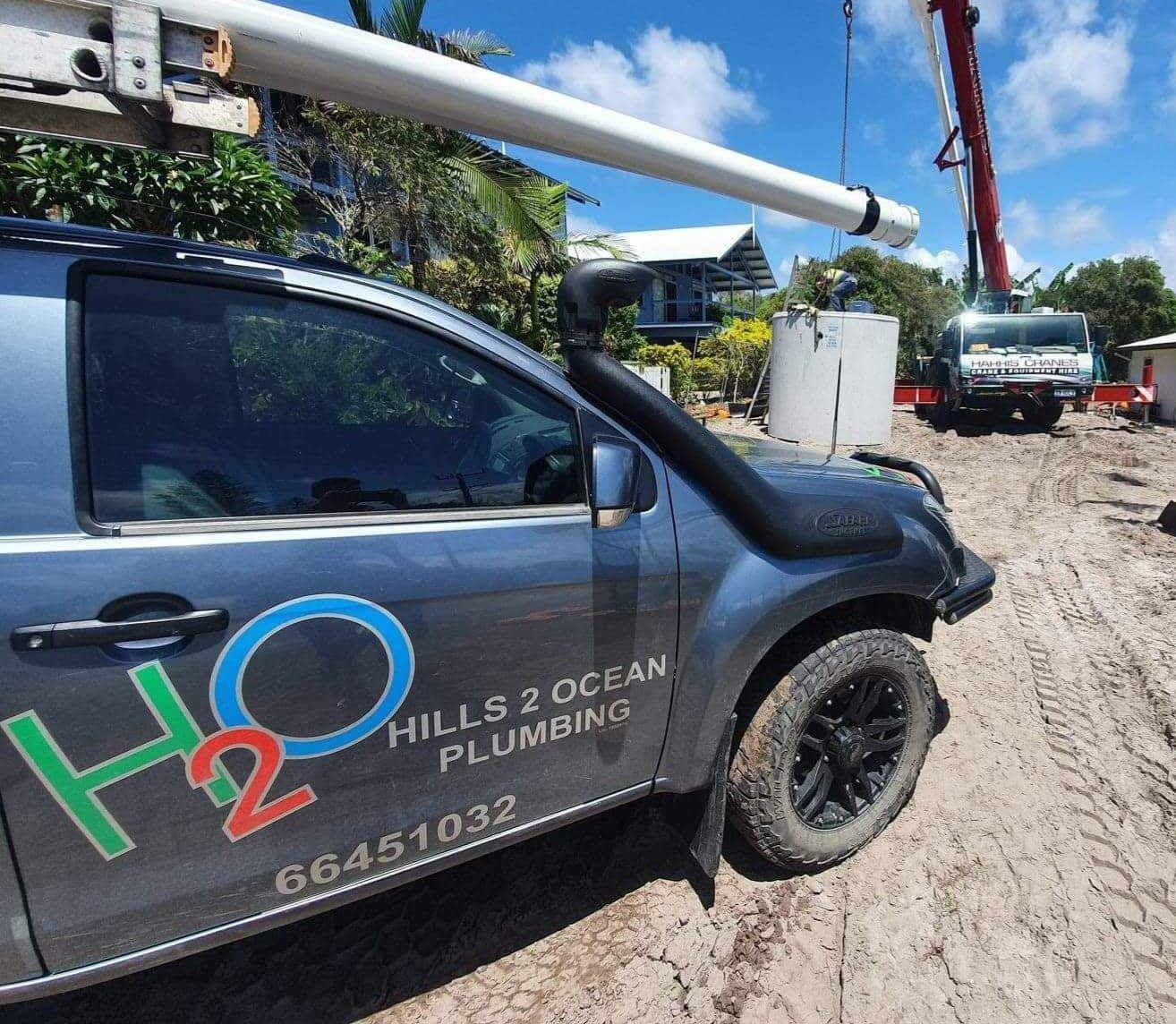 Dark Gray Hills 2 Ocean Plumbing Truck at a Construction Site — Hills 2 Ocean Plumbing in Maclean, NSW