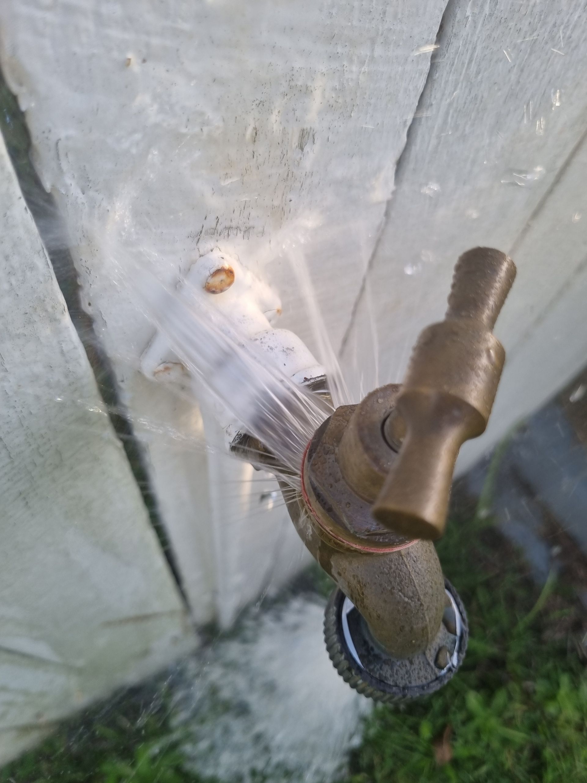 Water Spraying from A Damaged Outdoor Faucet — Hills 2 Ocean Plumbing in Maclean, NSW