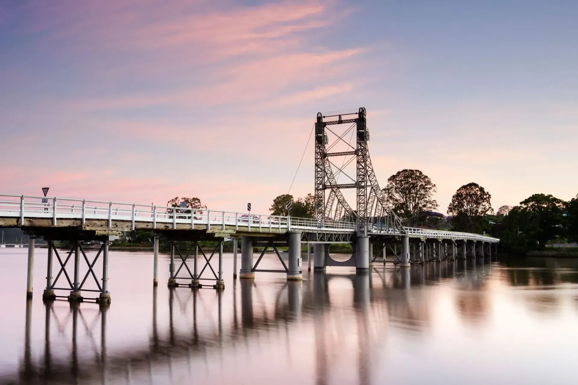 Bridge Over Calm Water at Sunset — Hills 2 Ocean Plumbing in Maclean, NSW