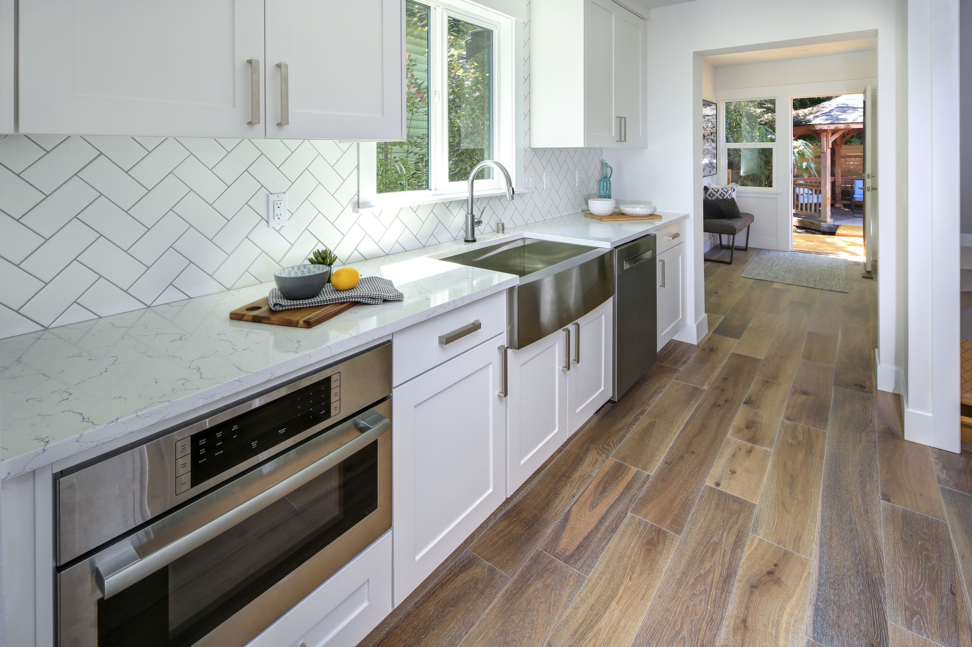 Remodeled kitchen with pure white cabinets.