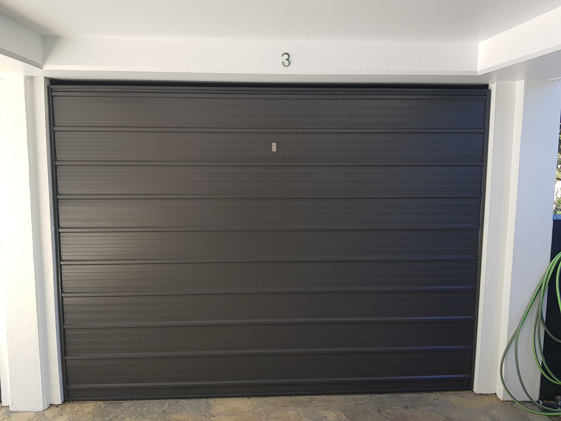 Black Garage Door — Noosaville, QLD — Noosa Door Centre