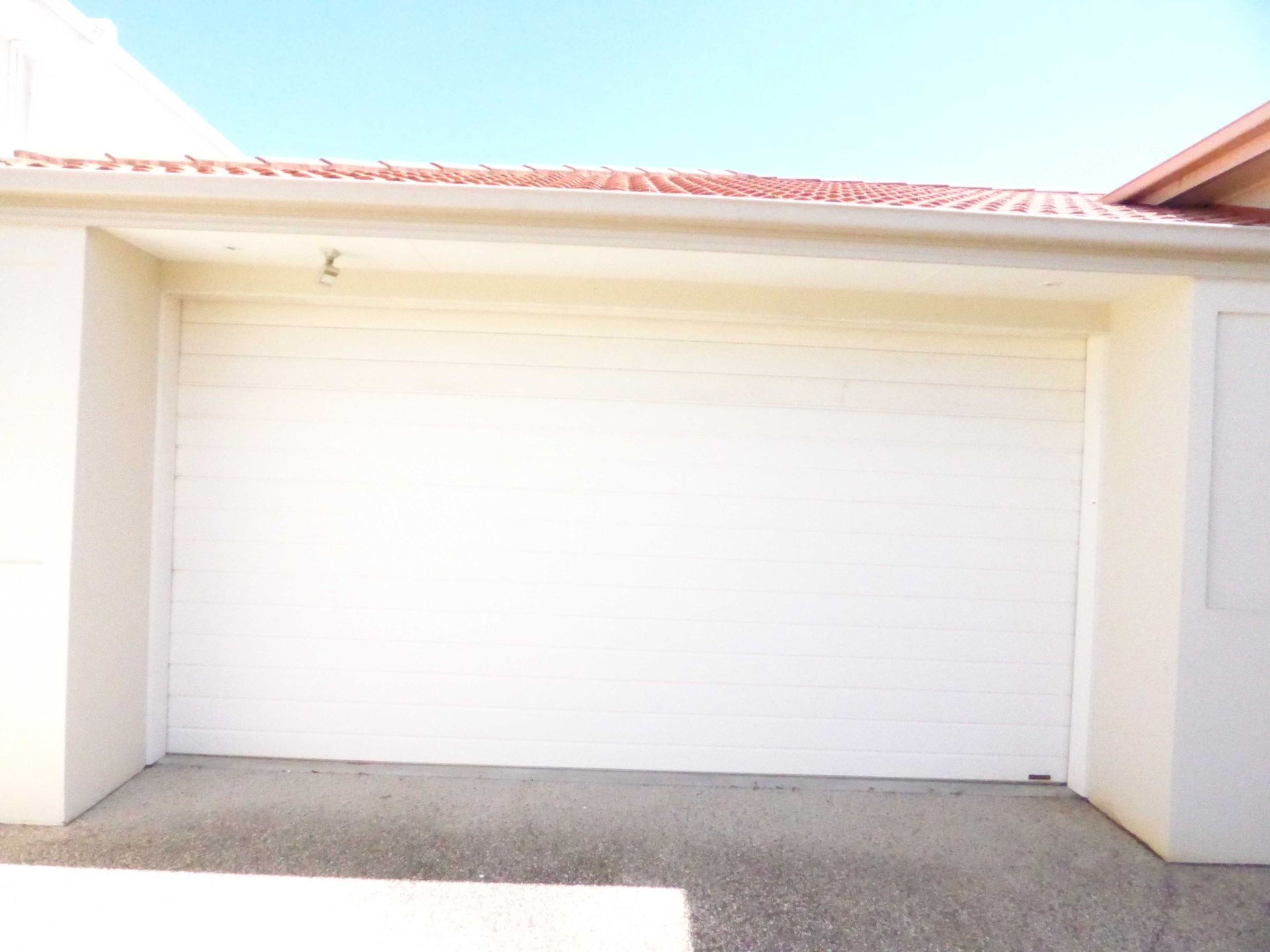 White Modern Garage Door — Noosaville, QLD — Noosa Door Centre
