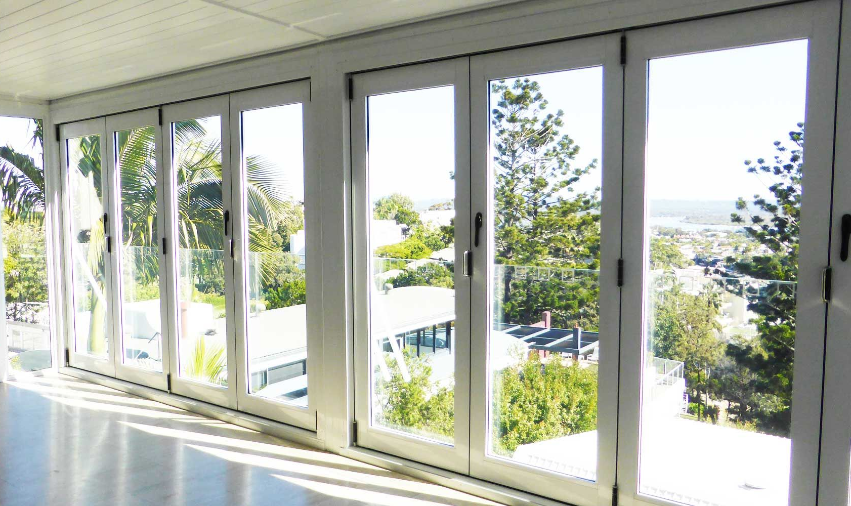 Aluminium sliding doors opening to outdoor living space in a Noosa home