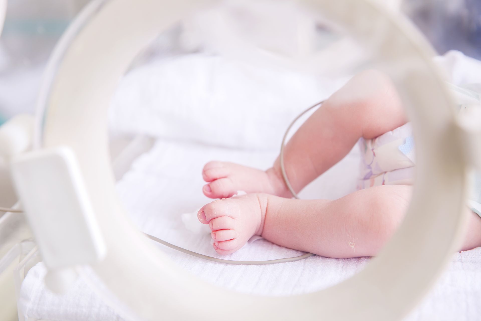A baby is sitting in an incubator in a hospital. Friends of Alfie Martin