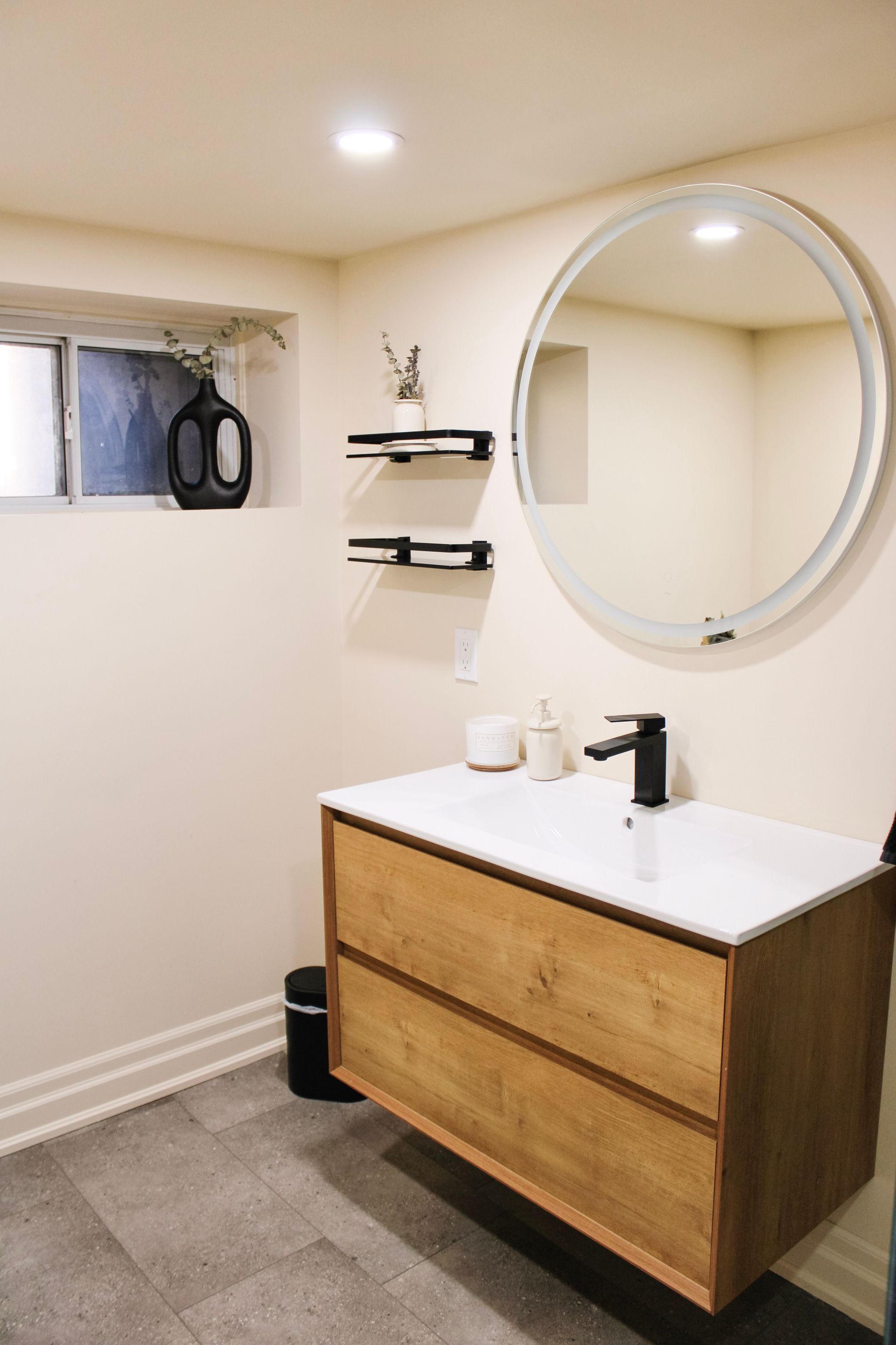 Bright white bathroom renovation with shaker vanity, matte black fixtures and quartz countertop, Stoney Creek Ontario