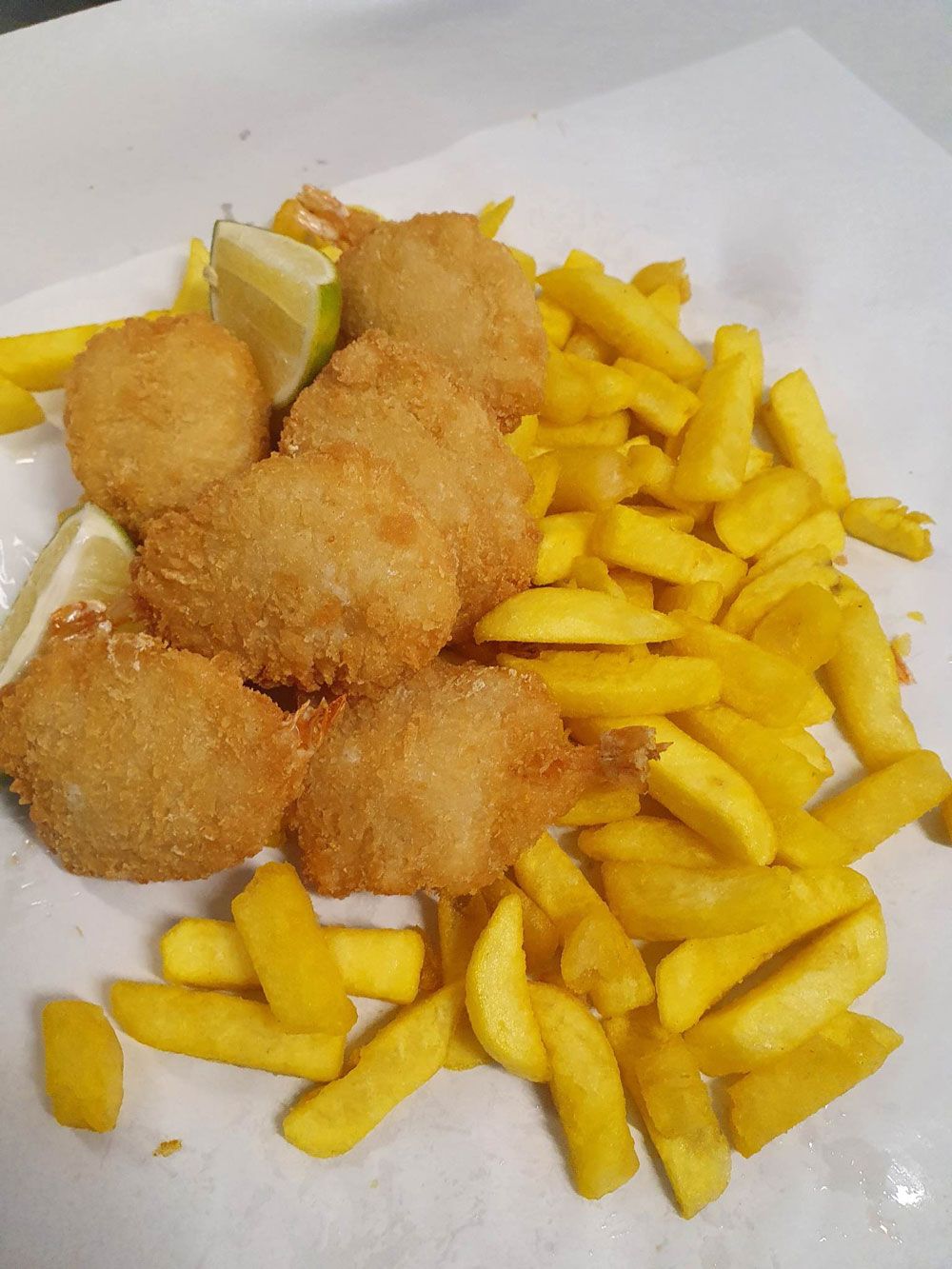 Crumbed Spanish Mackerel with fries and lemon— Fish & Chip Shop in Portsmith, QLD