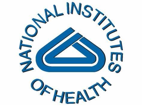 National Institutes of Health logo, a blue circle with text and an abstract, stylized building outline.