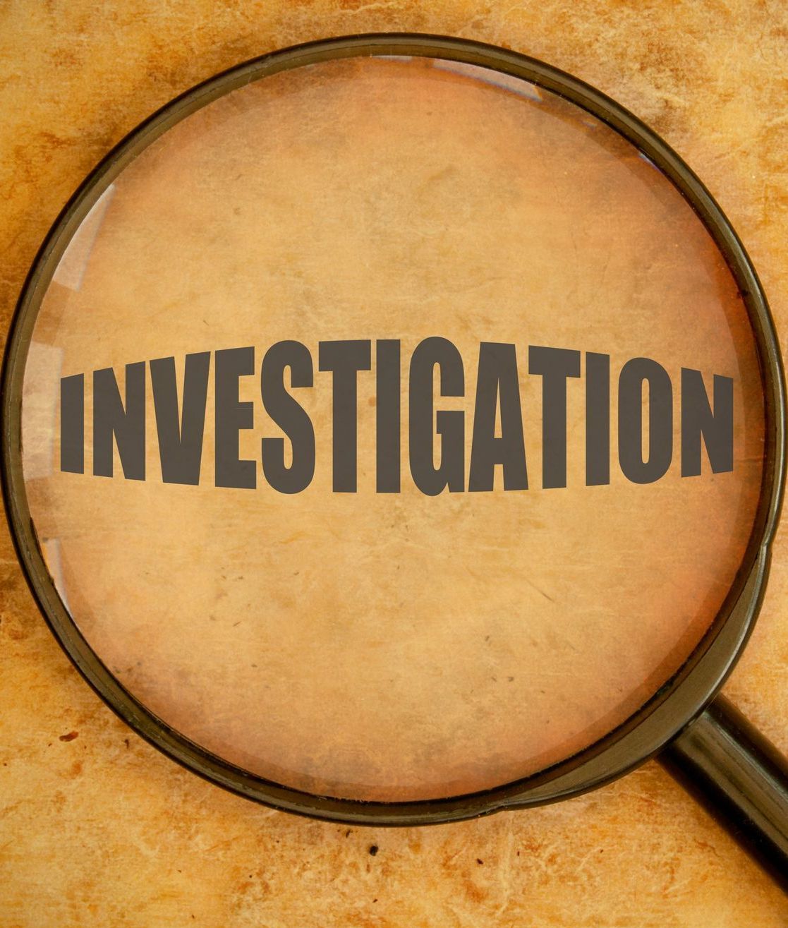 a magnifying glass with the word investigation on it