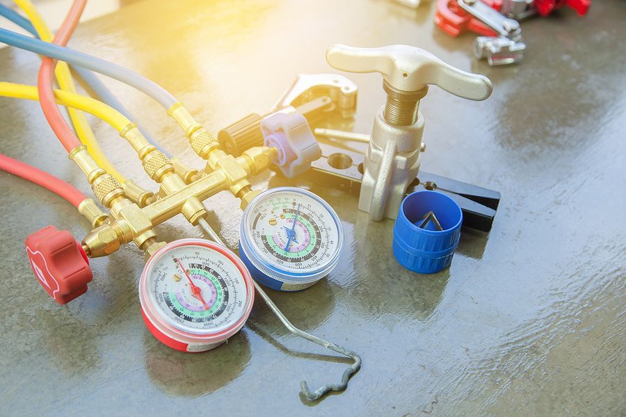 A close up of a bunch of tools and gauges on a table.
