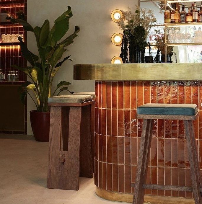 Cafe interior with a quote and mural on the wall: 