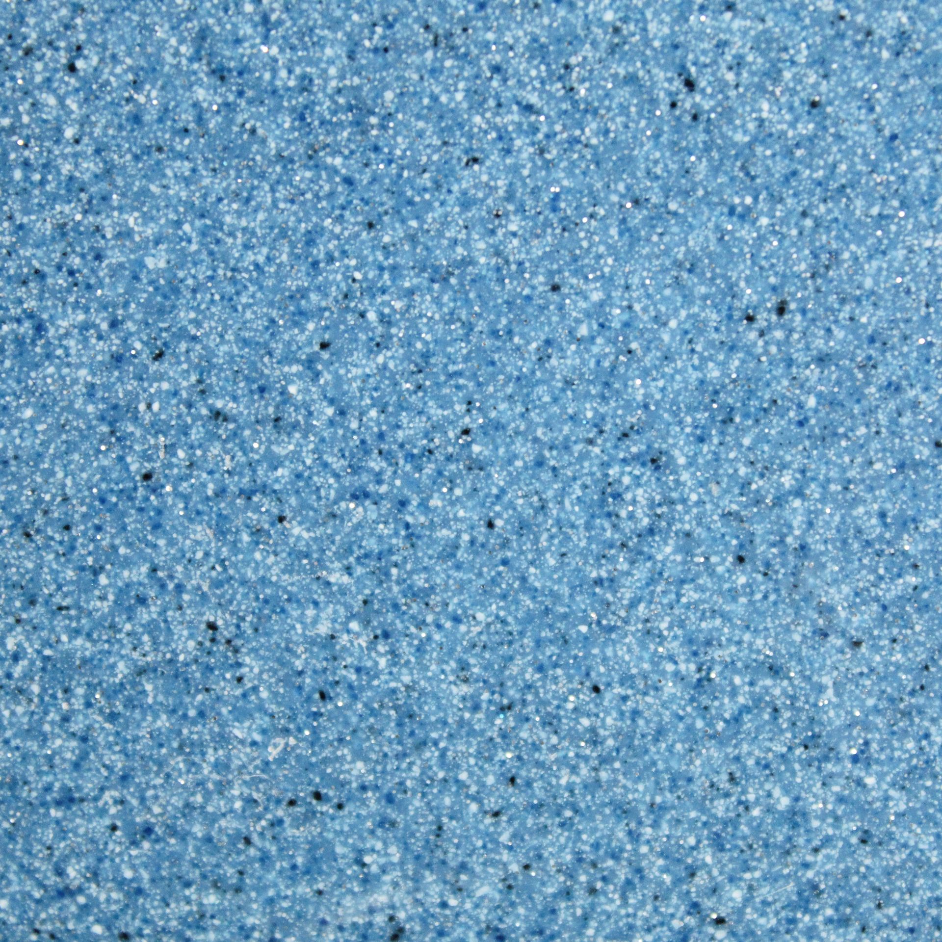 Blue speckled textured surface with fine white and dark flecks