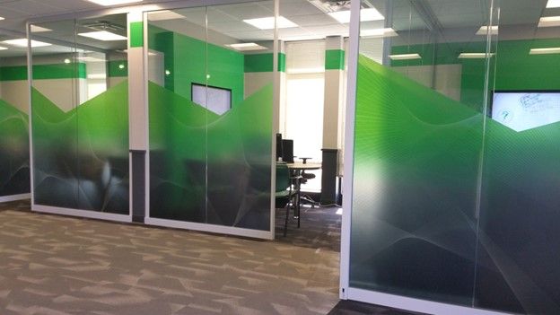 Commercial decorative green window films installed in a workspace in Miami, FL.