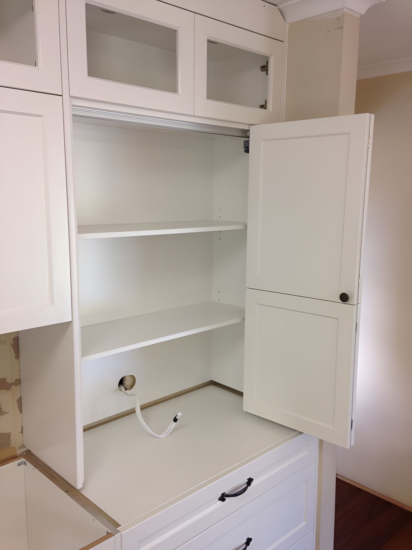 White Kitchen Cabinet, Open Door Showing Shelves — PK Kitchen Design in West Ipswich, QLD