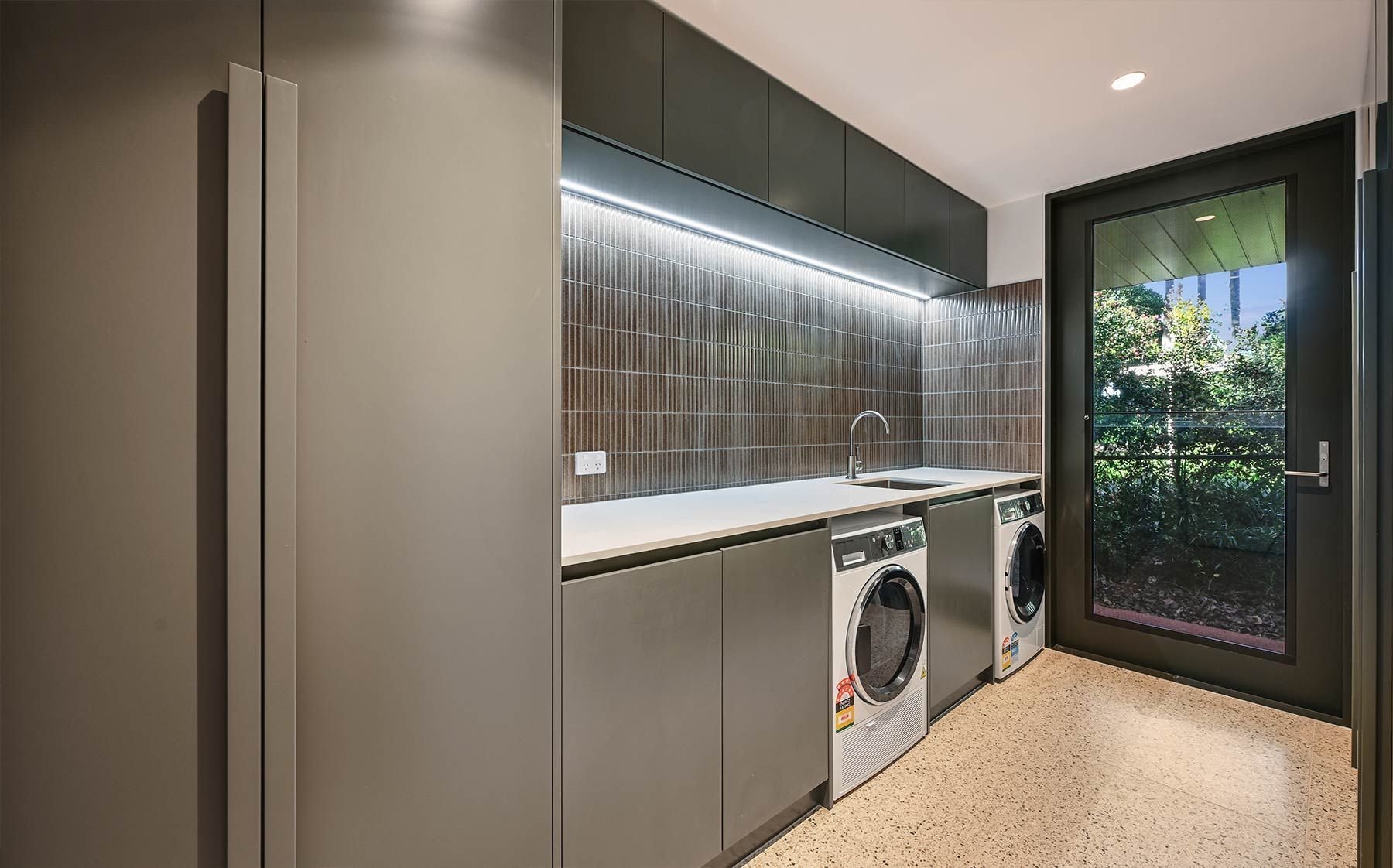 Modern Laundry Room With Dark Cabinetry — PK Kitchen Design in West Ipswich, QLD