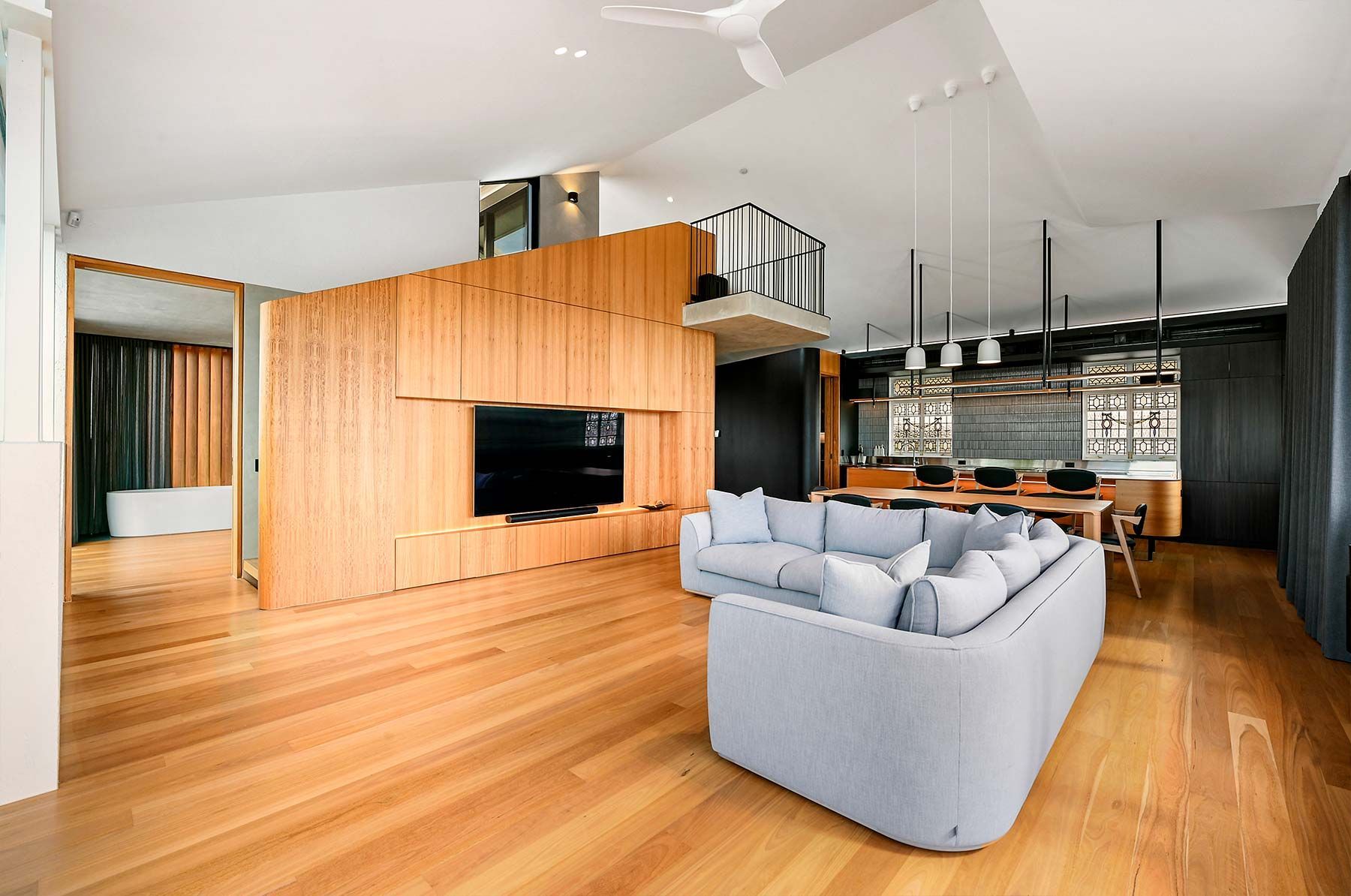 Modern Living Room With Wood Floors, Light Blue Couch — PK Kitchen Design in West Ipswich, QLD
