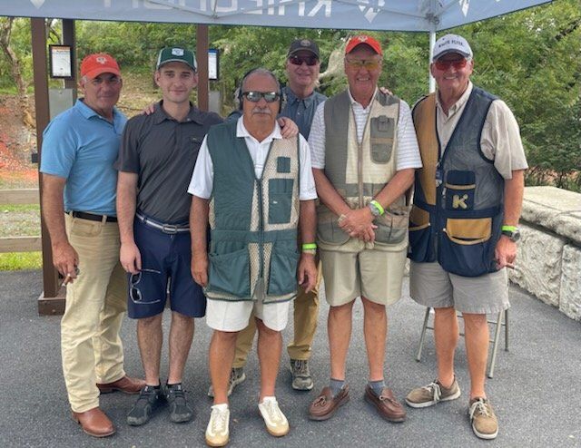 Joe Gaydos and community members at a charity shoot