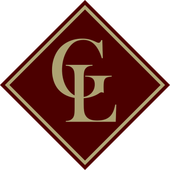Maroon diamond with gold outline; inside, gold letters 