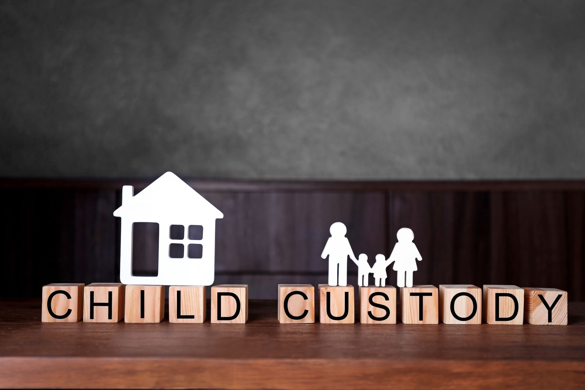 Child custody concept: Wooden blocks spelling 